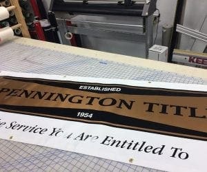 Gold and white Pennington title banner on a measuring table