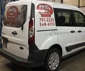 White van with red philly ted graphics on the side